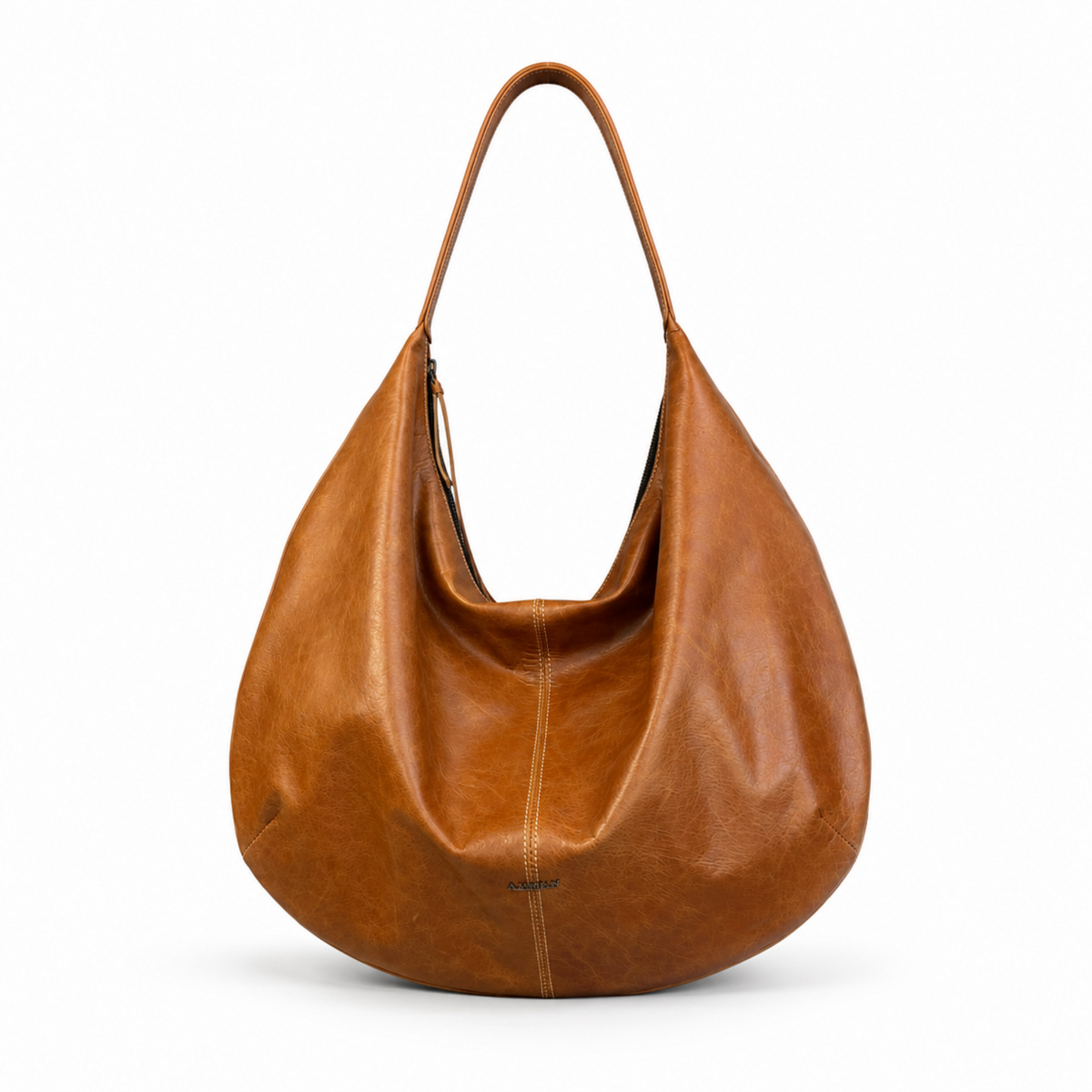 A slouchy, hobo-style shoulder bag made of smooth, warm cognac brown leather, shown against a plain white background.
