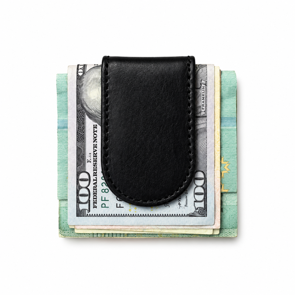 A black leather money clip wallet holding a stack of US $100 bills, photographed from directly above on a clean white background.