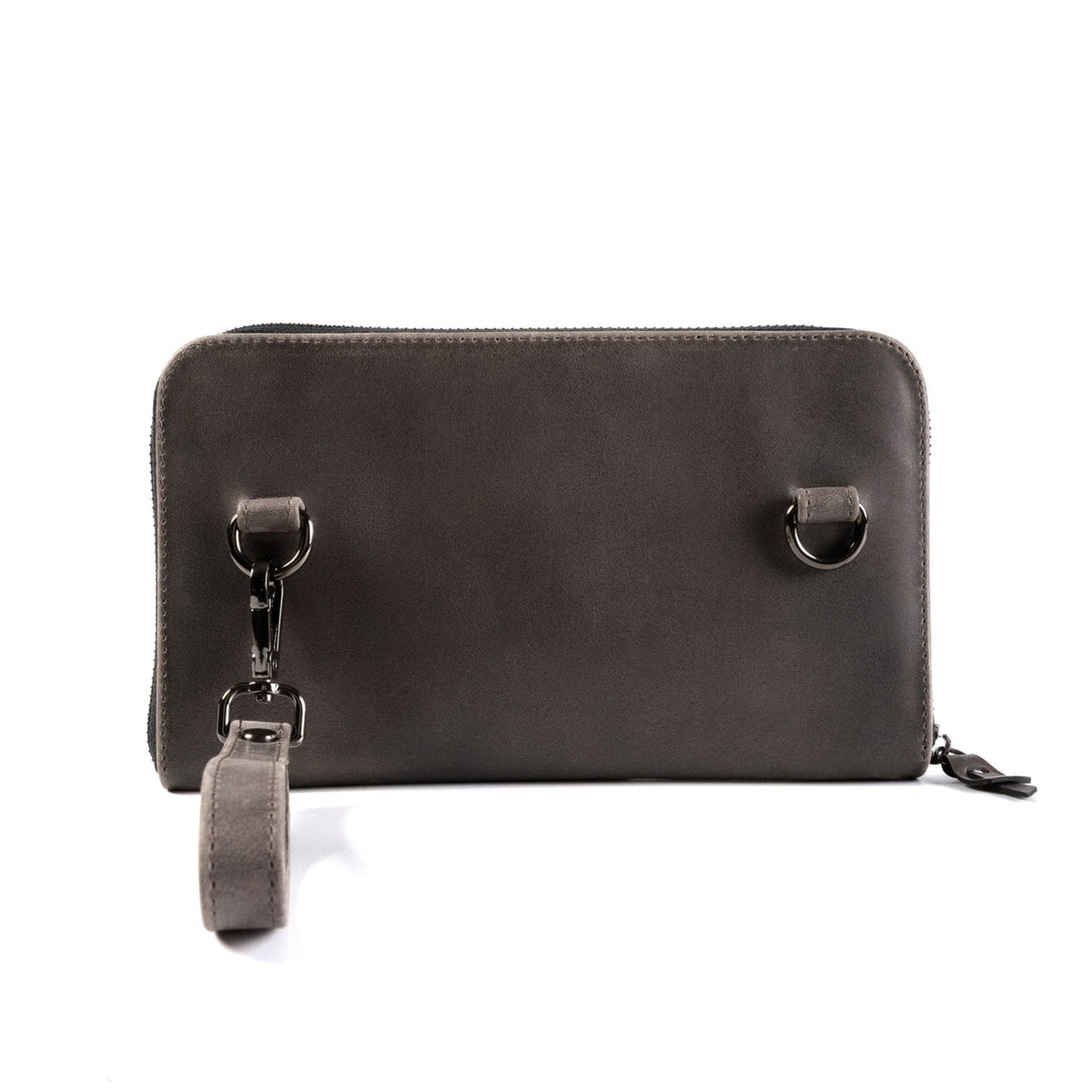 A dark brown leather zip-around wallet with a wristlet strap and metal D-ring hardware, shown on a plain white background.